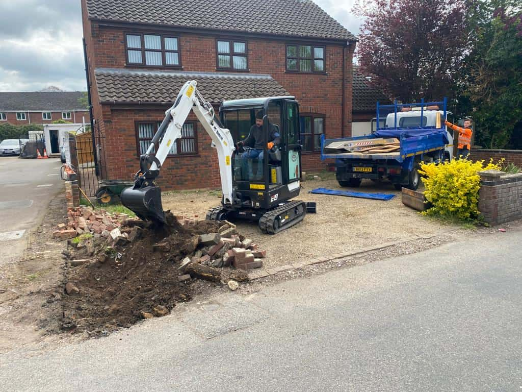 This is a photo of an operative of Daventry Driveways Digging out for a new tarmac driveway